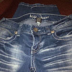Distressed aged jeans
